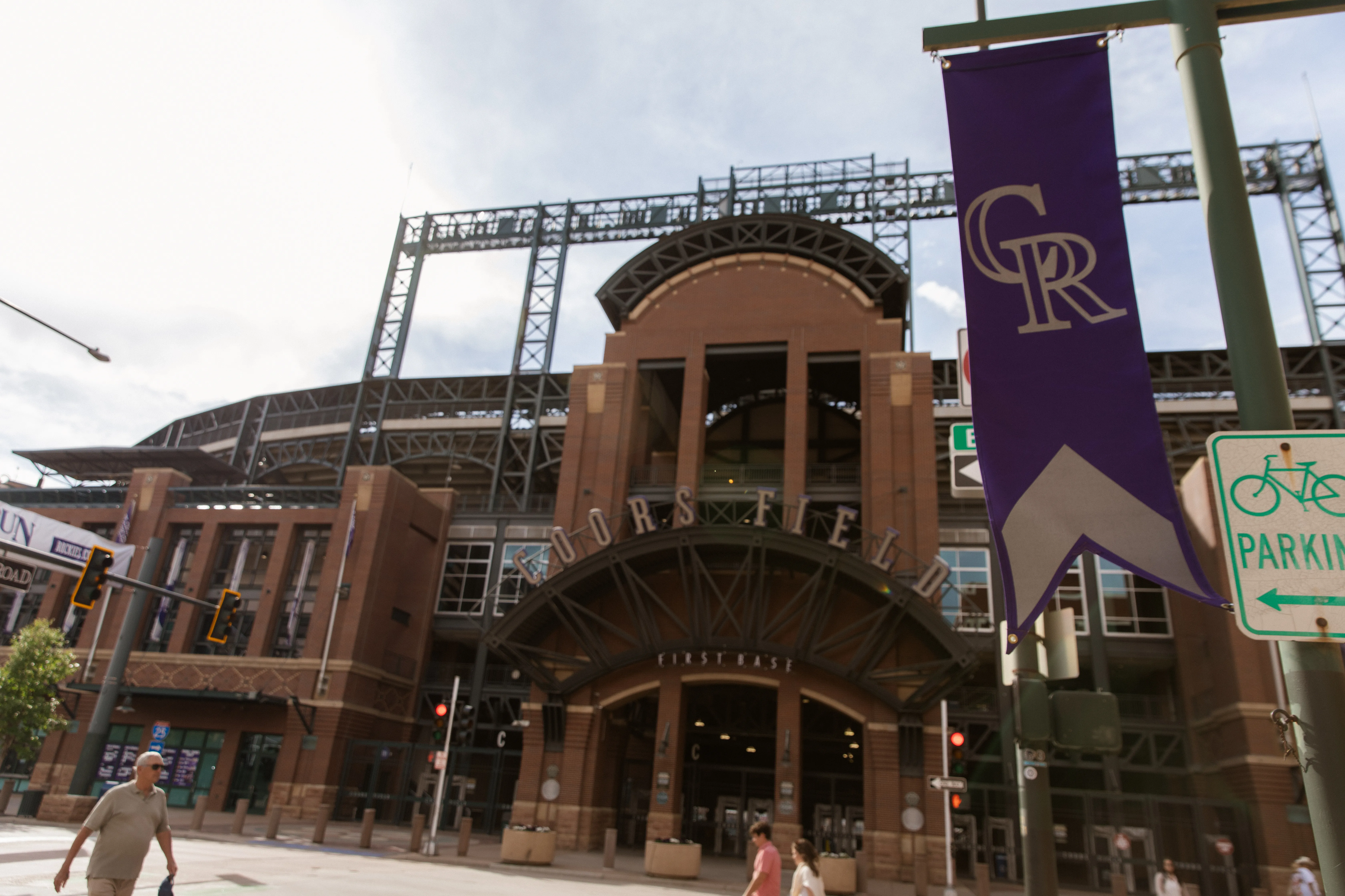 Rockies banners against the steel trusses