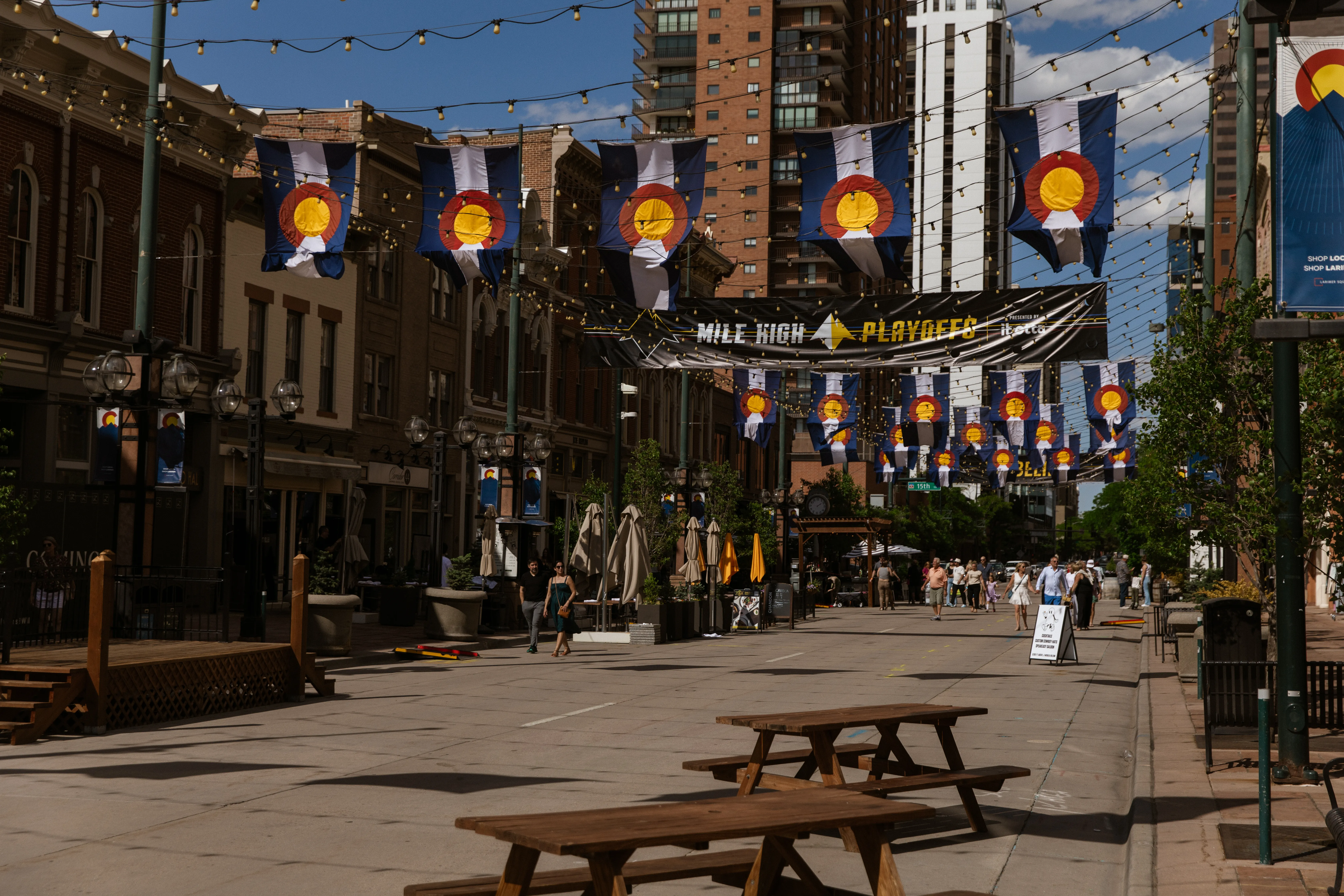 Colorado flags stretching down Larimer Square
